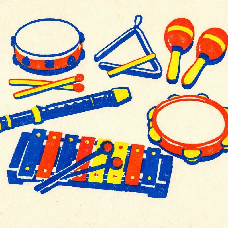 Tambour, guitare et xylophone posés côte à côte sur un tapis, avec une flûte et des maracas