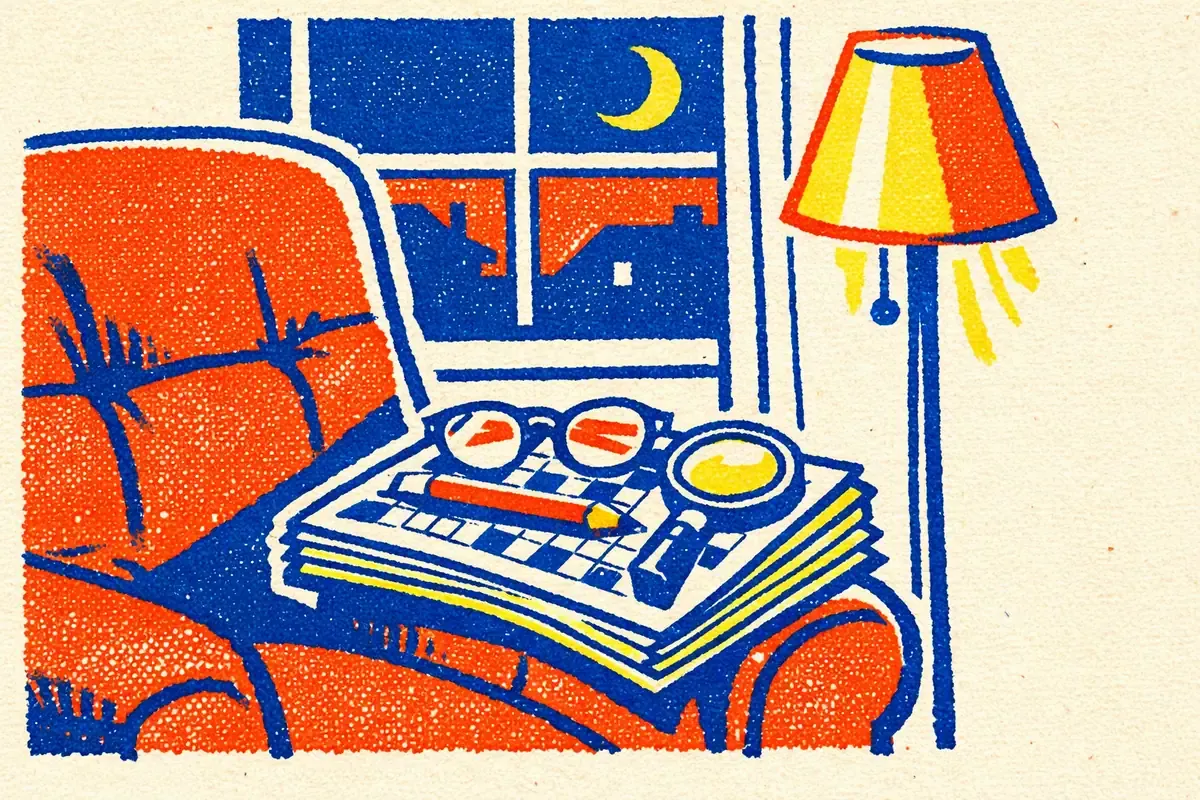 Fauteuil rouge et lampe allumée, une pile de cahiers de jeux quadrillés posée sur l'accoudoir avec des lunettes, un crayon et une loupe, devant une fenêtre de nuit